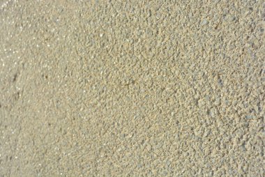 Sarı parlak arka plan, mat beyaz ve gri güneşin yansımasıyla birlikte çok küçük cam duvar inşaat taşlar.