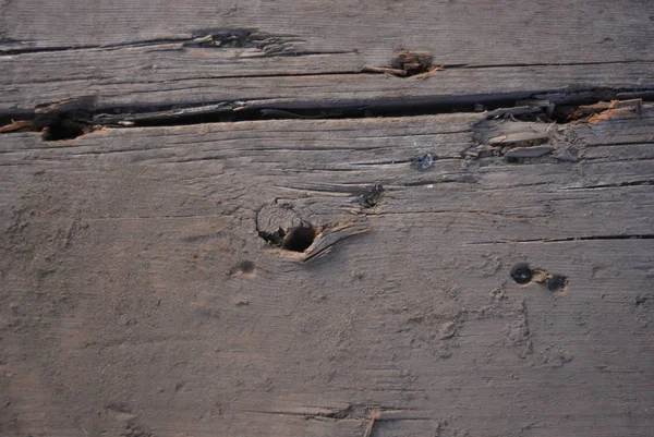 Holzhintergrund Eines Schwarzen Deck Mit Einem Rissigen Und Vertieften — Stockfoto