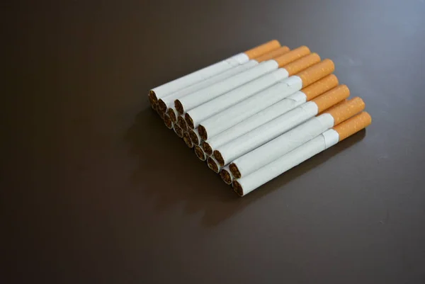 New Decomposed Many Cigarettes Brown Matte Background — Stock Photo, Image