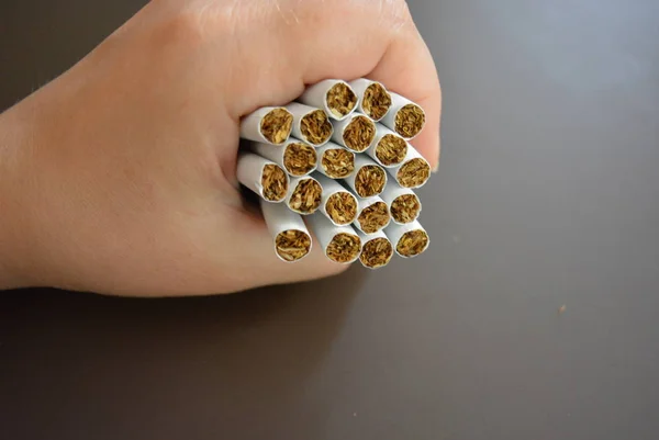 Cigarettes Female Fist Brown Matte Background — Stock Photo, Image