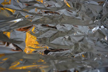 Şık metalik, gri, yansıtıcı melik arka plan. Parlaklık ve ışık efektleri ve parlak gümüş buruşuk Film Festival arka plan.