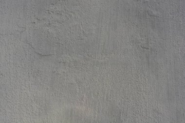 Açık hava kullanımı için beyaz yapısal alçı, yapısı ile sokak duvarı arka planı.