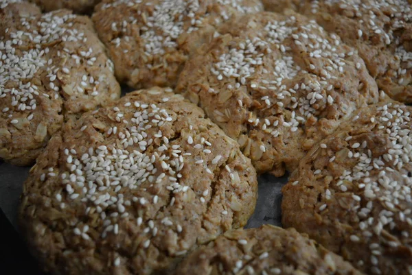 Delicious fresh homemade pastries, home cooking and food. Fragrant homemade songs from the stove. Tasty oatmeal rolls of oatmeal and flour.