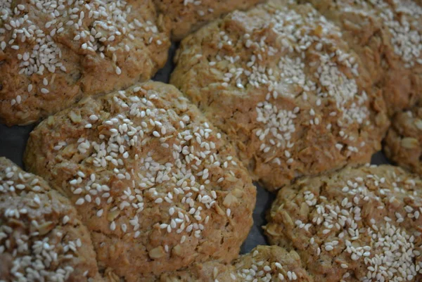 Delicious fresh homemade pastries, home cooking and food. Fragrant homemade songs from the stove. Tasty oatmeal rolls of oatmeal and flour.