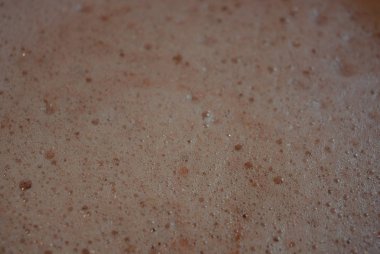 Suyu pembe yumuşak köpük, küçük kabarcıklar ile reçel, hassas yenilebilir arka plan.