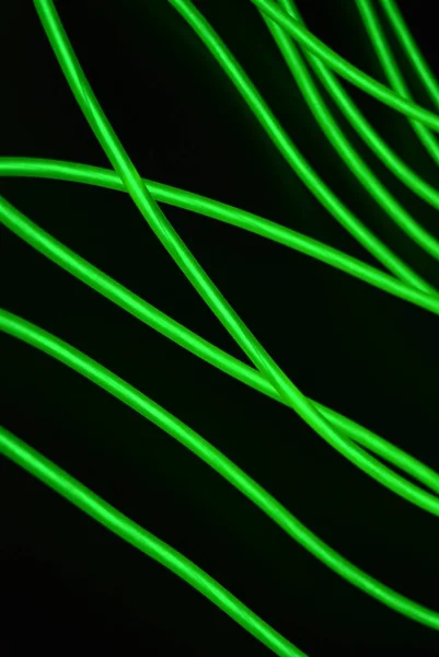 Farklı Şekil Yapılara Sahip Toksik Yeşil Işıklı Elektrolüminesans Telleri Siyah — Stok fotoğraf