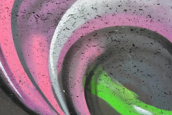 The image is made of paint from colored spray cans. Color chaotic patterns, white, pink, black, green paints and colors.