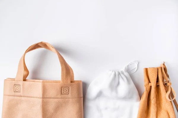 Zero waste concept. Set recycled home accessories - eco-friendly bags, glass and wooden supplies