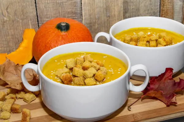 Autumn Pumpkin Soup Sesame Seeds Wooden Background Two Bowls Orange — Stock Photo, Image