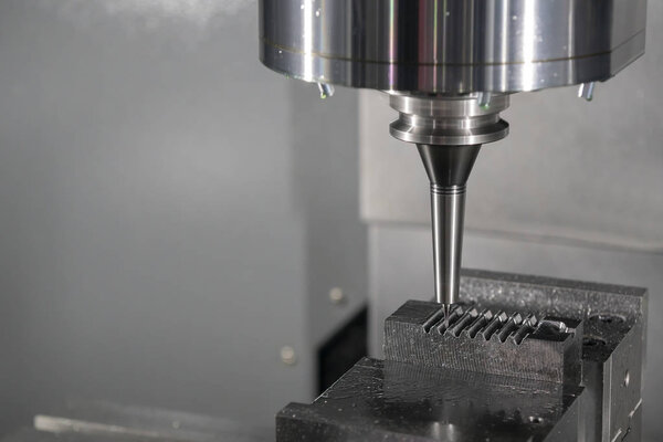 The CNC milling machine cutting the injection mold by solid ball end-mill tool.Hi-technology manufacturing process.