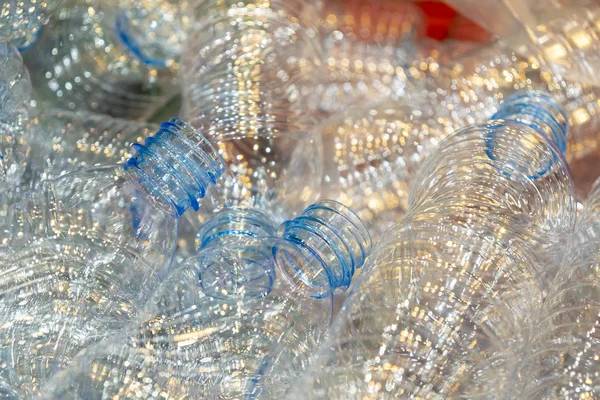 The new plastic bottles in the container at the drinking factory . Drinking water manufacturing process.