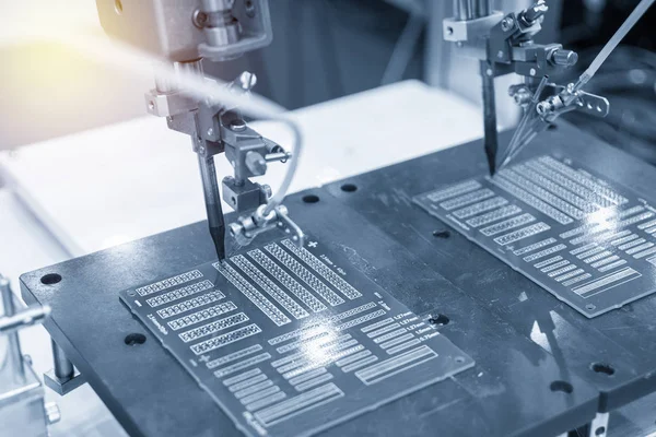 The soldering robotic system in the electronic factory.