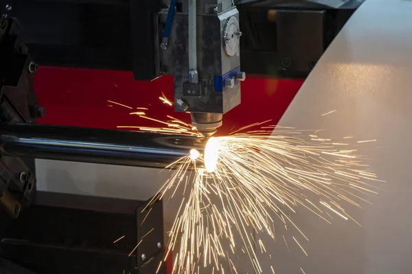 The fiber laser cutting machine cutting the stainless steel tube