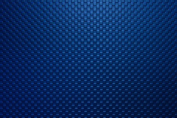 The dark blue square block shape embossed texture background.