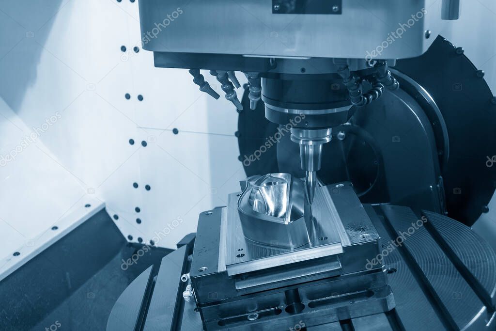 The 5 axis CNC machining center cutting the automotive mold parts with solid barrel end mill tools. The hi-technology automotive part manufacturing process by 5 axis CNC milling machine.