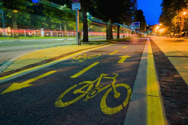 Bike path with signs at night motion