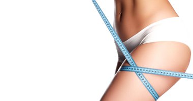 Güzel kalçaları mükemmel şekli ölçme kadın. Sağlıklı yaşam konsepti. Kadın vücut parçası ölçülür. Spa Güzellik vücut parçası. Sağlıklı yaşam, diyet ve fitness