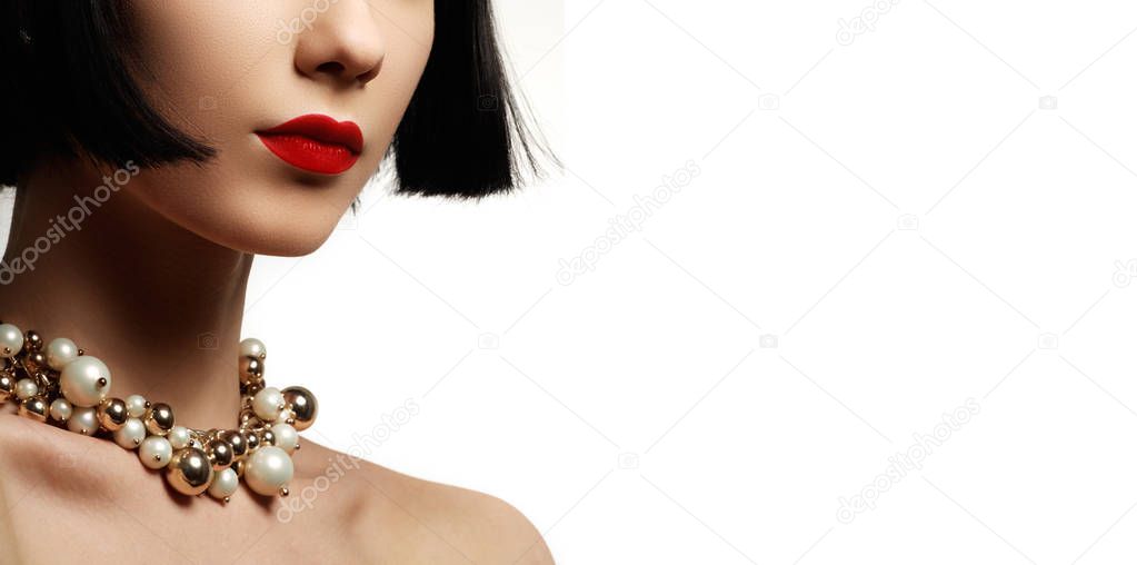The beautiful woman in expensive pendant close-up. Beautiful young woman model with perfect makeup wearing jewelry. Fashion portrait of beautiful luxury woman with jewelry