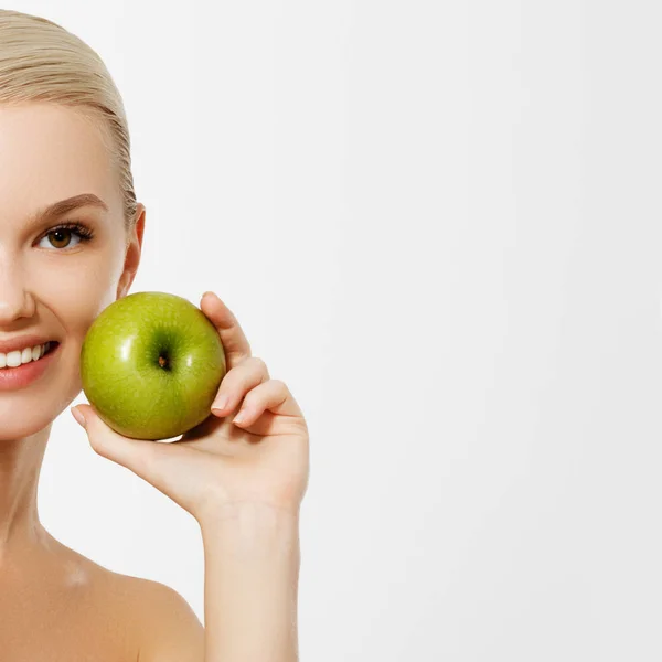 Healthy Diet Food. Closeup Portrait Of Beautiful Happy Smiling Young Woman With Perfect Smile, White Teeth And Fresh Face Holding Organic Green Apple. Dental Health Concept. High Resolution Image — Stock Photo, Image