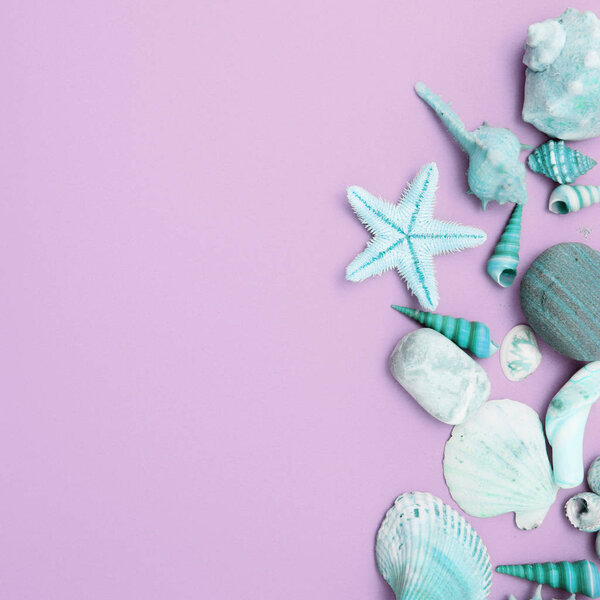 Composition of exotic seashells, oyster, starfish and lemon slices on white wooden background. Tropical summer vacation or sea food concept. Flat lay, top view. Marine design.