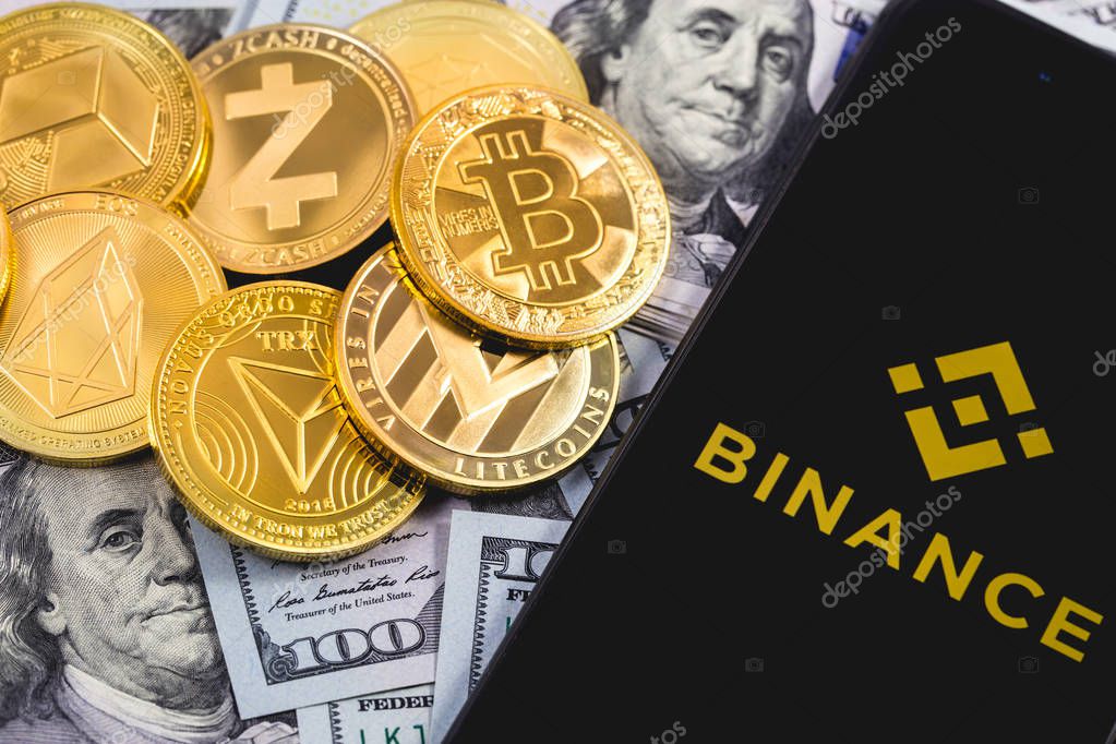 Apple iPhone and Binance logo, and dollars, cryptocurrency. Binance is a cryptocurrency exchange. Ekaterinburg, Russia - September 19, 2018