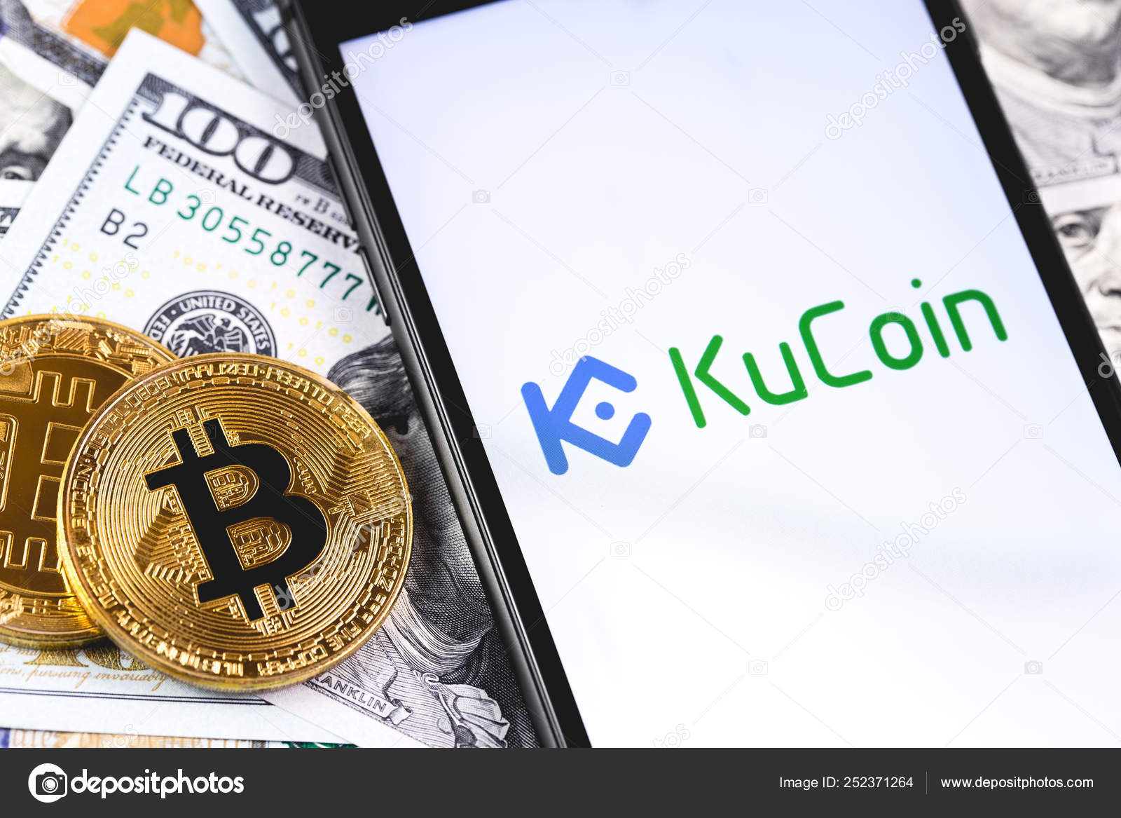 비트 코인, 화면 스마트 폰에 쿠코인 로고와 달러 — 스톡 에디토리얼 사진 © Primakov #252371264