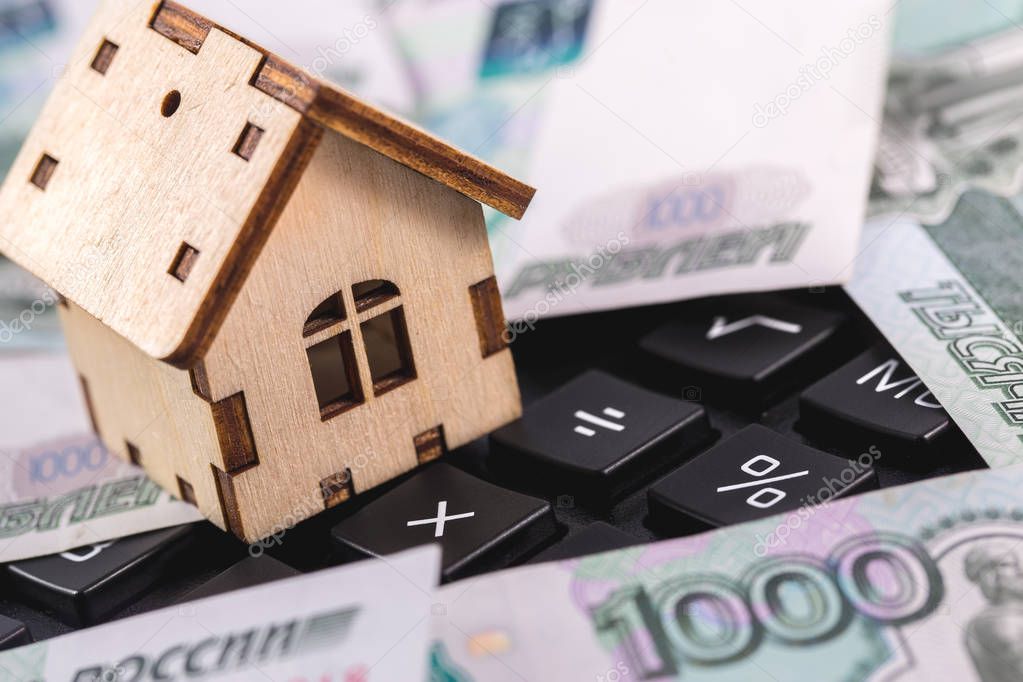 symbol house with money, russian rubles on the calculator