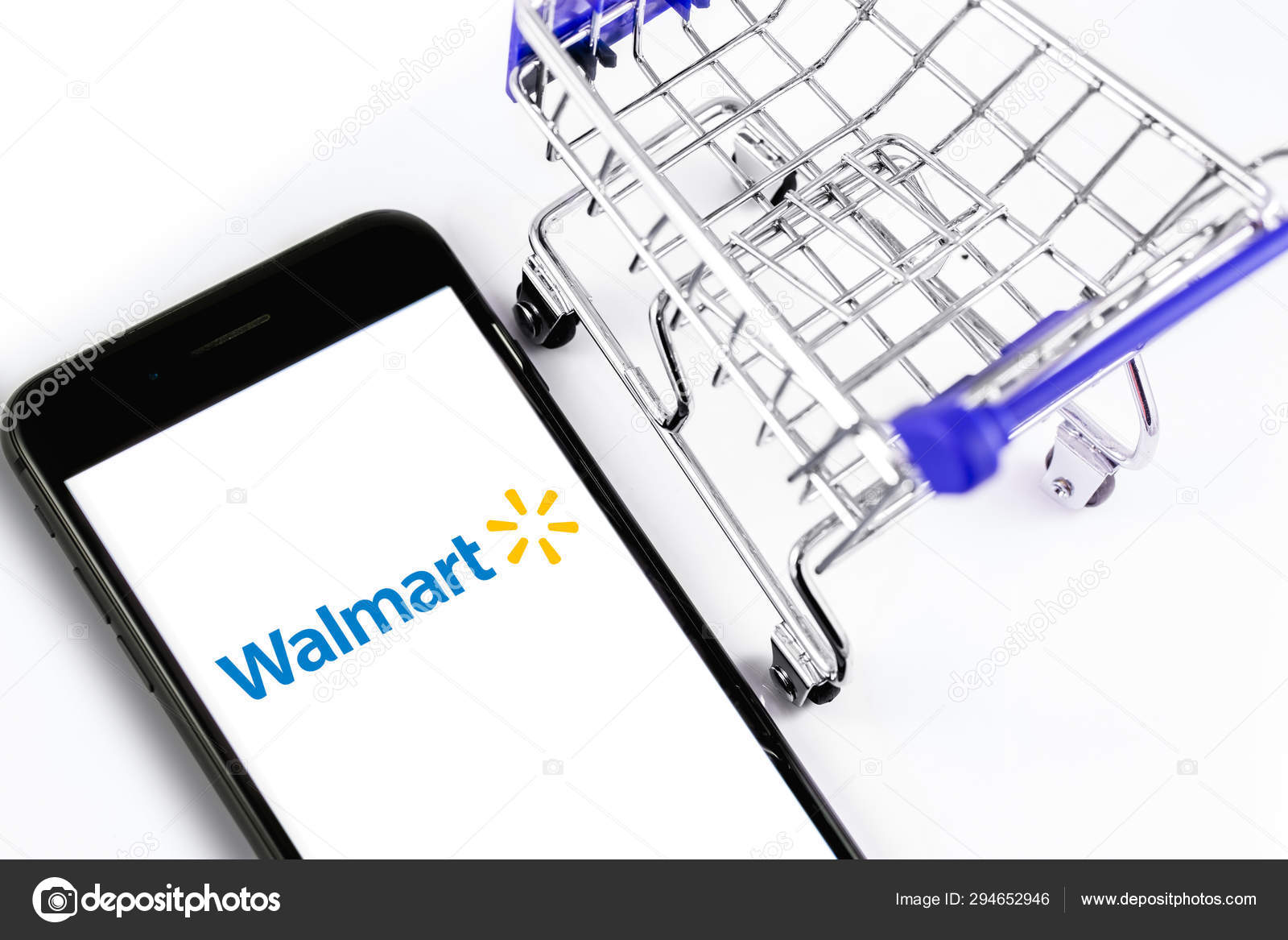 Walmart Stock Phone Number >> Shopping Cart And Walmart Logo On The Screen Smartphone Walmart Stock Phone Number >> Shopping Cart And Walmart Logo On The Screen Smartphone