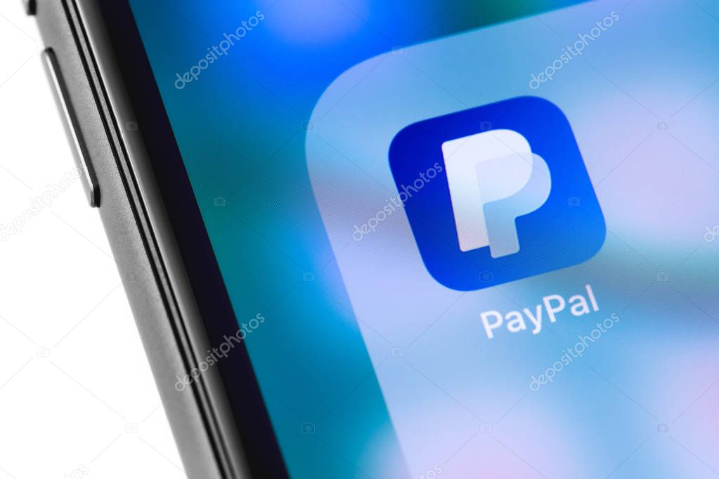 PayPal logo on the screen smartphone. Paypal is an internet based digital money transfer service. Moscow, Russia - March 15, 2019