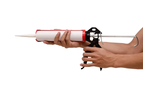 Mannen hand houden Caulking Gun en witte siliconen sealant — Stockfoto
