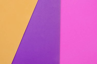 Mor, pembe ve turuncu nun üst üste binen renkli kağıt arka plan