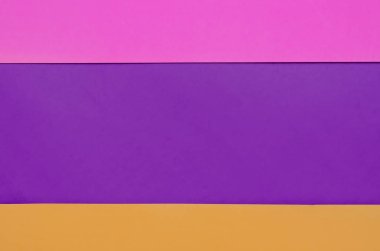 Mor, pembe ve turuncu nun üst üste binen renkli kağıt arka plan