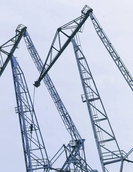 Lifting cranes inversion. Loading and construction. Large lifting cranes