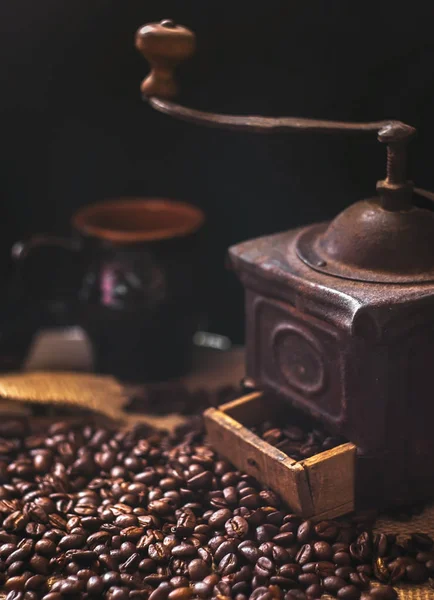 coffee beans and vintage coffee grinder. Roasted coffee beans in