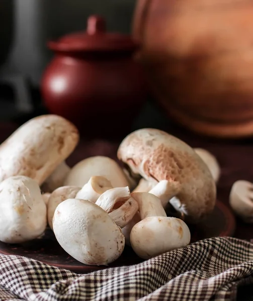 Fresh champignon mushrooms group on the table. Fresh vegetables — Stock Image Fresh champignon mushrooms group on the table. Fresh vegetables Stock Picture
