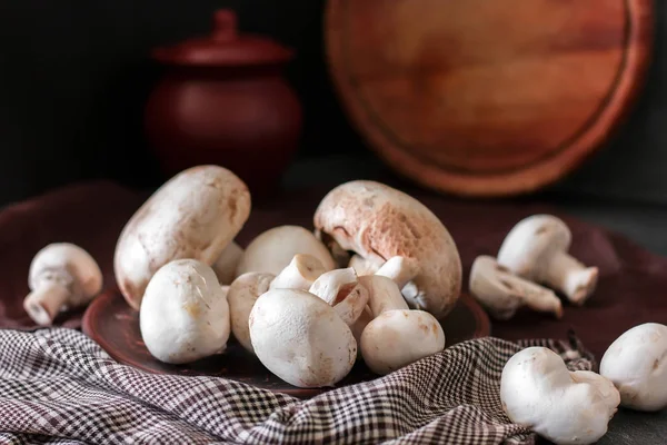 Fresh champignon mushrooms group on the table. Fresh vegetables — Stock Image Fresh champignon mushrooms group on the table. Fresh vegetables Royalty Free Stock Images