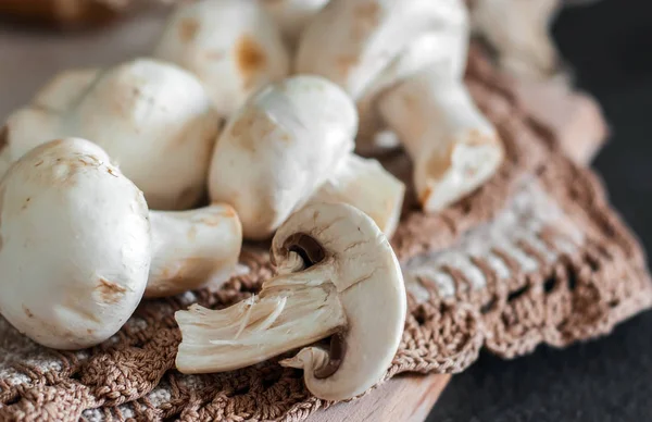 Fresh champignon mushrooms group on the table. Fresh vegetables — Stock Image Fresh champignon mushrooms group on the table. Fresh vegetables Royalty Free Stock Photos