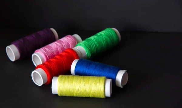 Multicolor Sewing Threads On Wooden Background Stock Photo, Picture and  Royalty Free Image. Image 28961608.