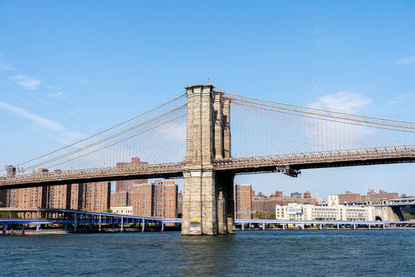 New York, United States - September 23, 2019: View of famous Brooklyn Bridge towards Manhattan in New York City.