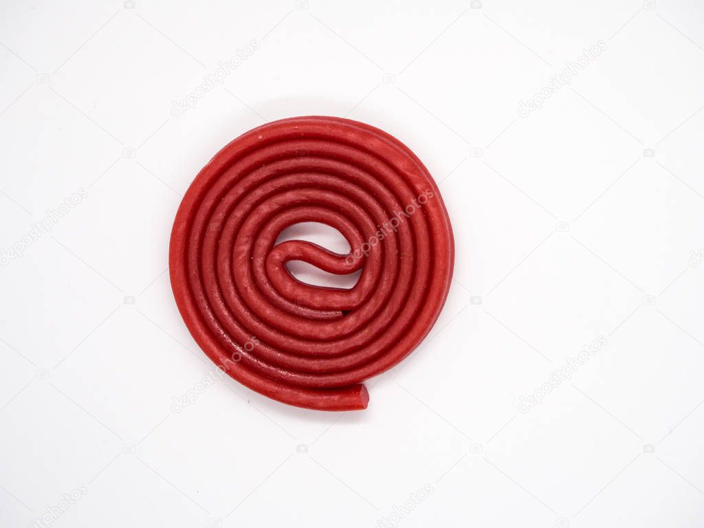 Red licorice on white background