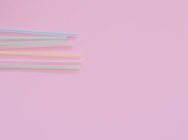 Kopyalama alanı ile pembe arka plan üzerinde plastik pipetler