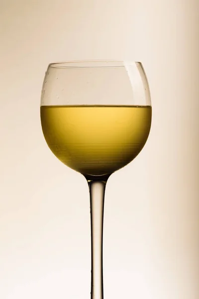 Glass of white wine on white background — Stock Photo, Image