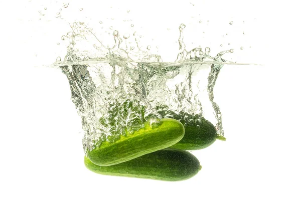 Cucumber splashing water isolated on white background. Skin moisturizing cosmetics — Stock Photo, Image