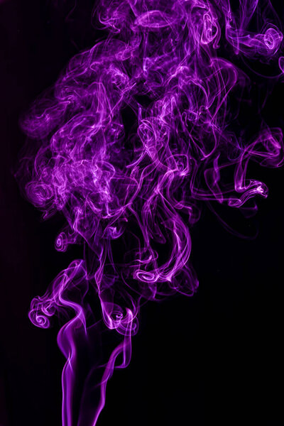 Purple abstract shaped smoke against black background. Abstract background