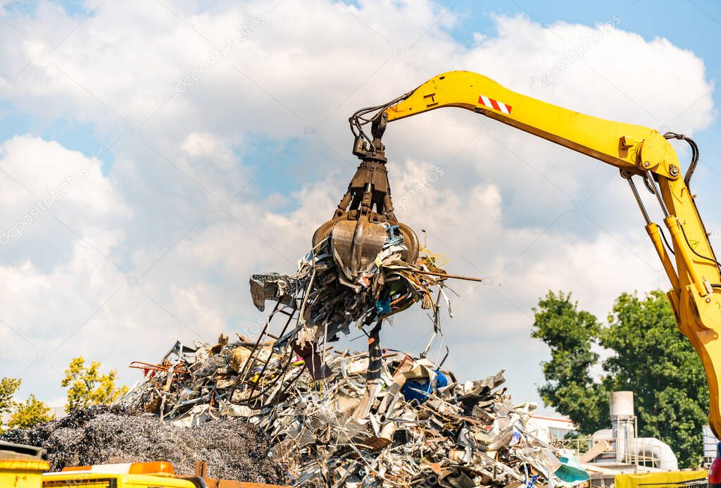 Close-up of a crane for recycling metallic waste on scrapyard