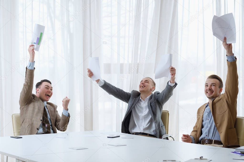 business success happy laughing men celebrating