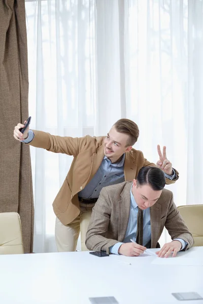 Annoying coworker selfie business work ethics — Stock Photo, Image