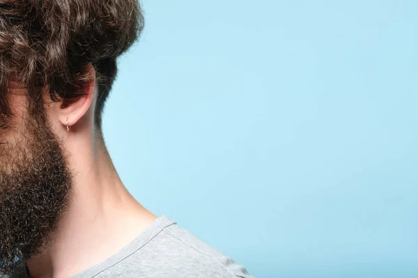 back neck curly dark haired bearded man barbershop