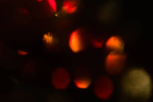 Lens flare röd suddig bakgrundsbokeh jul — Stockfoto