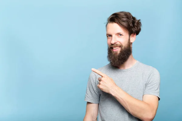 Smiling hipster man point text product advertising — Stock Photo, Image